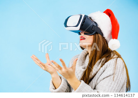 Girl watching 3d film tour in virtual reality glasses. 134614137