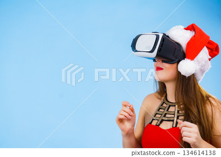 Girl watching 3d film tour in virtual reality glasses. 134614138