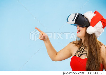 Girl watching 3d film tour in virtual reality glasses. 134614139