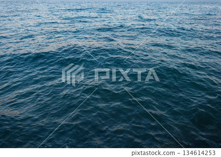 Deep blue sea with soft waves and natural texture, ideal background for marine, travel, and summer design concepts. Croatia, Opatija. Summer holidays Deep blue sea with soft waves and natural texture, ideal background for marine, travel, and summer design concepts. Croatia, Opatija. Summer holidays 134614253