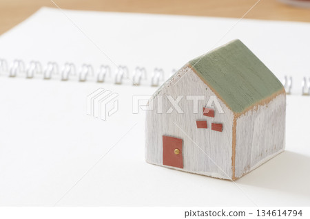 House-building notebook and wooden house model House-building notebook and wooden house model 134614794