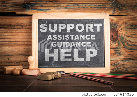 Support Concept. Chalkboard on a wooden office desk 134614839
