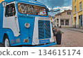 Porvoo, Finland - December 08, 2020: Blue Citroen food truck is parked on a cobblestone street, surrounded by quaint buildings, creating a vibrant and inviting atmosphere 134615174