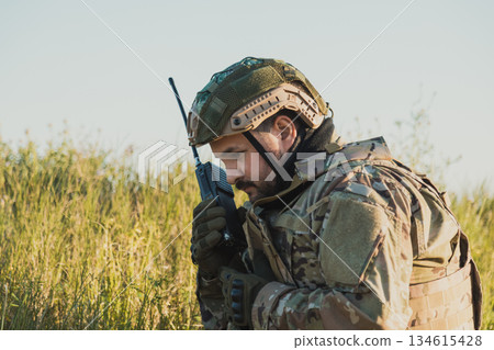 Soldier Trying To Entstablish Communication With His Team  134615428