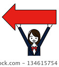 A female student in a uniform holding a red arrow pointing left 134615754