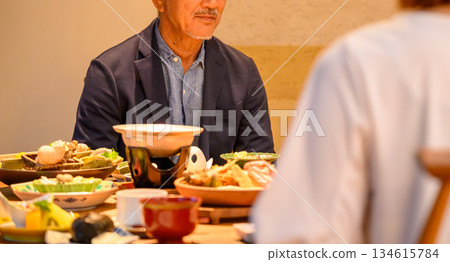 A middle-aged man enjoying kaiseki cuisine 134615784