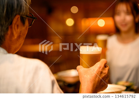 Senior man and daughter toasting Senior man and daughter toasting 134615792