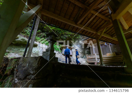 The couple heads towards the shrine on the rocks The couple heads towards the shrine on the rocks 134615796