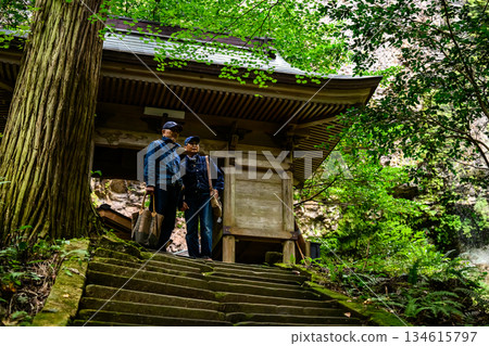 Senior couple climbing stone steps Senior couple climbing stone steps 134615797