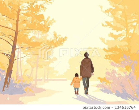 Rear view of a parent and child walking hand in hand in a park at dusk 134616764