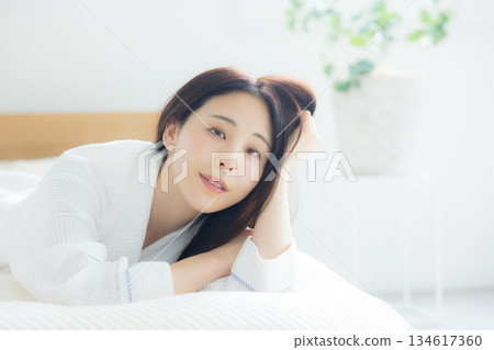 A woman relaxing at bed A woman relaxing at bed 134617360