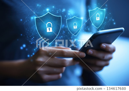 Person Making Contactless Payment Using Smartphone with Security Icons in Background Person Making Contactless Payment Using Smartphone with Security Icons in Background 134617680