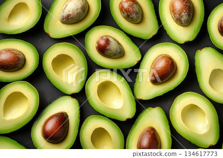 Fresh Avocado Halves Arranged in a Dynamic and Visually Appealing Composition Fresh Avocado Halves Arranged in a Dynamic and Visually Appealing Composition 134617773