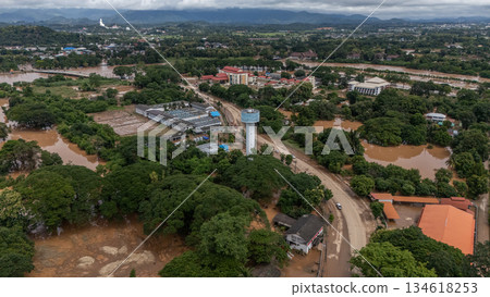 Aerial view of suburb area in Chiang Rai province flooding by Kok river after typhoon Yagi has swept Southeast Asia. 134618253