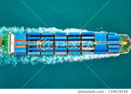 Shipping logistics. Commercial shipping. Cargo ship in sea, aerial view. Massive cargo ship. Freight container loaded on vessel. Aerial view cargo ship entering harbor. Cargo business. Container ship Shipping logistics. Commercial shipping. Cargo ship in sea, aerial view. Massive cargo ship. Freight container loaded on vessel. Aerial view cargo ship entering harbor. Cargo business. Container ship 134619240