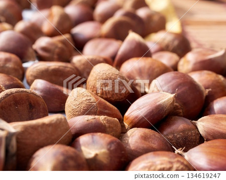 Freshly harvested autumn chestnuts being dried Freshly harvested autumn chestnuts being dried 134619247