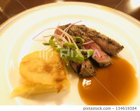 Close-up of Wagyu beef cut steak served on a shiny plate 134619384