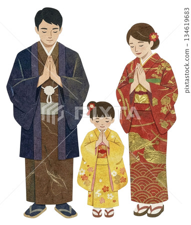 A family of three dressed in kimonos made from washi paper visiting the shrine 134619683