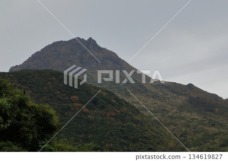 The summit of Mount Unzen Fugen Heisei Shinzan as seen from Shimabara Mayuyama Road 134619827