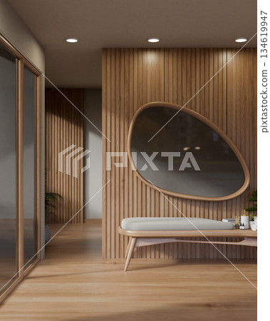 Oval shape mirror on wall over a wooden cushion bench with essentials at spa massage waiting area. Oval shape mirror on wall over a wooden cushion bench with essentials at spa massage waiting area. 134619947