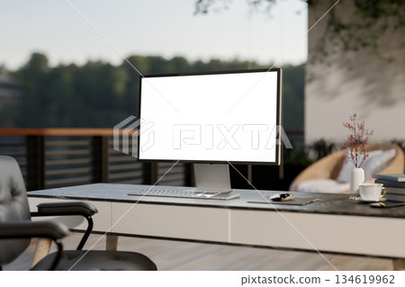 White screen computer on black marble table and armchair at the rooftop of a house or building. White screen computer on black marble table and armchair at the rooftop of a house or building. 134619962