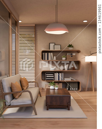 Wooden table and large armchair under ceiling lamp in a cosy living room with stylish bookshelf. 134619981