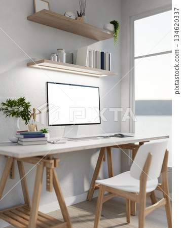 Blank screen computer with books and a wooden figure aside on white table in a clean bright room. Blank screen computer with books and a wooden figure aside on white table in a clean bright room. 134620337