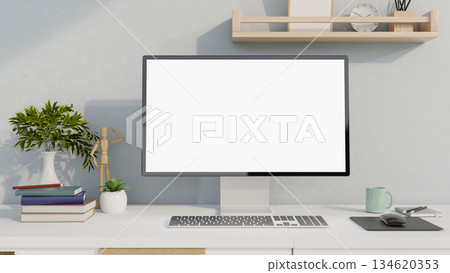 Blank screen computer with books and decors on white table, study corner in bedroom or living room. 134620353