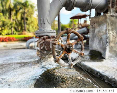 Geothermal power plant equipment with control valve and steam pipeline, representing renewable energy, sustainable electricity generation, clean technology, and eco friendly industrial infrastructure 134620371