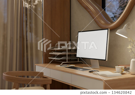 Blank screen computer on wooden table with chair under odd shape window in a living room or bedroom. 134620842