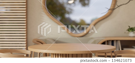 Empty round table and armchairs in a dining room or a cafe with odd shaped window and wooden blinds. Empty round table and armchairs in a dining room or a cafe with odd shaped window and wooden blinds. 134621073