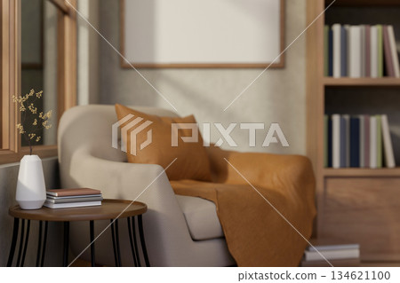 Armchair with pillow and blanket aside wooden stool table and bookshelf with sunlight through window 134621100