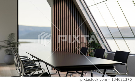 Black table and swivel chairs under roof window in an office or company's meeting room with scenery. Black table and swivel chairs under roof window in an office or company's meeting room with scenery. 134621370
