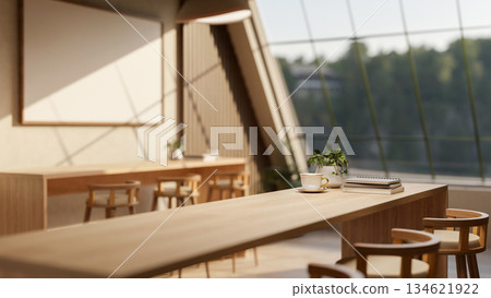 Coffee cup aside book on wooden counter with stool chairs under roof window in a cafe or coffee shop Coffee cup aside book on wooden counter with stool chairs under roof window in a cafe or coffee shop 134621922