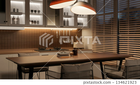Coffee cup and book on wooden table with chairs in kitchen or dining room with blinds covered window 134621923