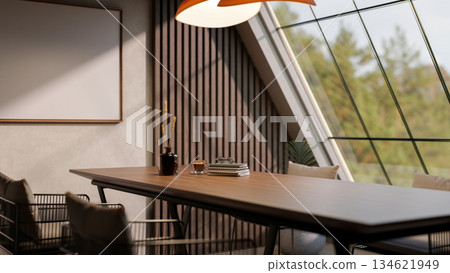 A coffee cup and books on wooden table with armchairs under roof window in a meeting or living room. 134621949