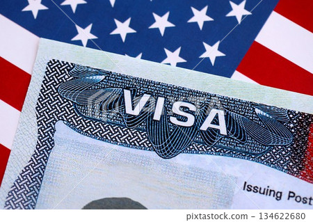 VISA to the USA and the flag of the United States of America. Work and travel documents for visiting the USA. Visa for immigration 134622680