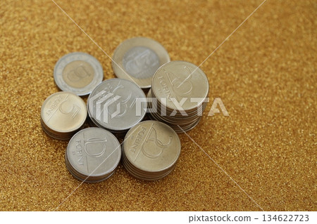 Many Hungarian forint coins in big amount close up. Forint is an official Hungarian currency instead euro Many Hungarian forint coins in big amount close up. Forint is an official Hungarian currency instead euro 134622723