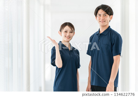 Male and female care staff including care managers, physical therapists, and occupational therapists working in nursing homes, hospitals, and day care centers 134622776