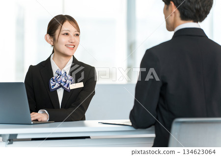 A young Asian businesswoman negotiating, serving and meeting with a male customer A young Asian businesswoman negotiating, serving and meeting with a male customer 134623064
