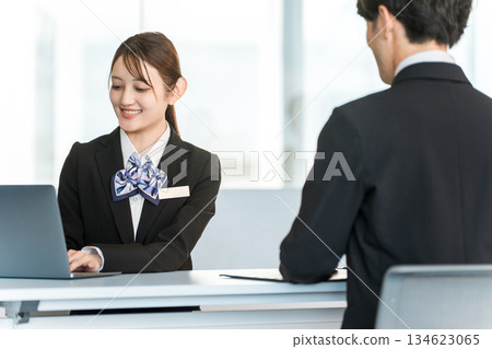 A young Asian businesswoman negotiating, serving and meeting with a male customer A young Asian businesswoman negotiating, serving and meeting with a male customer 134623065
