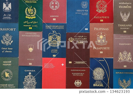 Big amount of biometrical passports from various different countries close up Big amount of biometrical passports from various different countries close up 134623193
