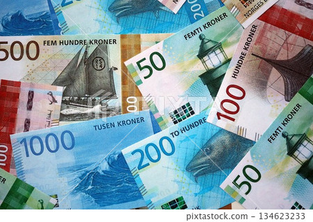 Norwegian Krone currency money bills. NOK currency banknotes in stack with different denomination close up 134623233