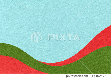 Textured pastel blue paper background with red and green wavy lines and waves, copy space for banner, presentation 134624259