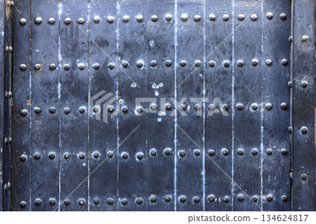 Close up detail of vintage wood gate, Old flat wooden with pitting, rust and rivets. Close up detail of vintage wood gate, Old flat wooden with pitting, rust and rivets. 134624817