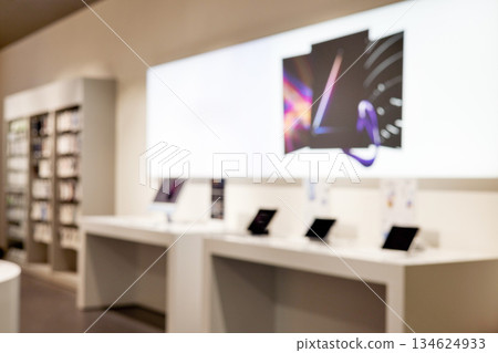 Blurred modern technology store interior with abstract display Blurred modern technology store interior with abstract display 134624933