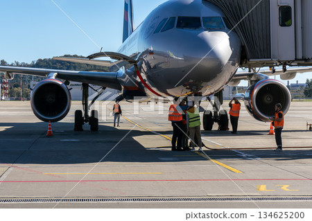 Sochi, Russia - July 20 2024: An airplane cabin docked at the airport terminal. Sochi, Russia - July 20 2024: An airplane cabin docked at the airport terminal. 134625200