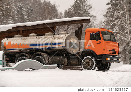 Truck with a tank for water delivery in winter. 134625317