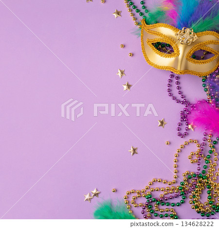 Mardi Gras and fat Tuesday background. Festive decorations on a lilac background 134628222