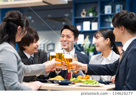 Businessmen toasting with beer Businessmen toasting with beer 134628277